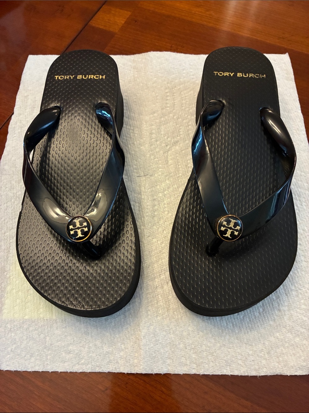 Tory Burch Black Jelly Logo Flip Flops with Gold Emblem I’d say size 5.5.